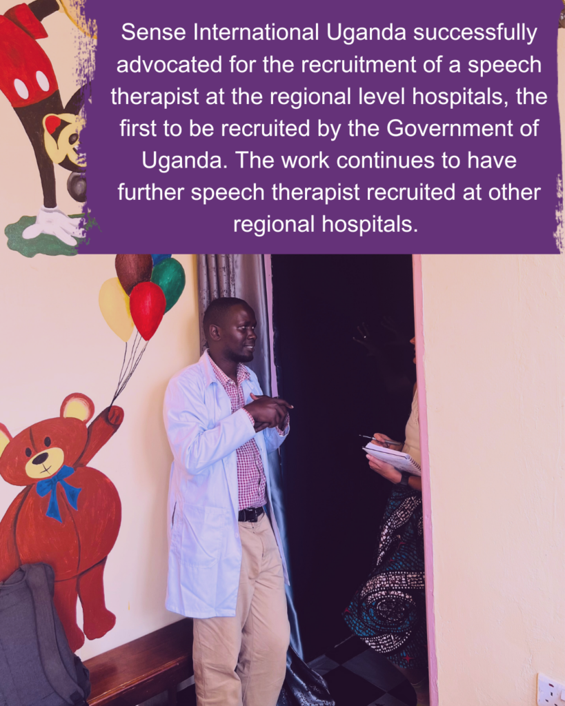 A Ugandan man wearing a lab coat stands in front of a child's mural. Text reads: Sense International Uganda successfully advocated for the recruitment of a speech therapist at the regional level hospitals, the first to be recruited by the Government of Uganda. The work continues to have further speech therapist recruited at other regional hospitals. 