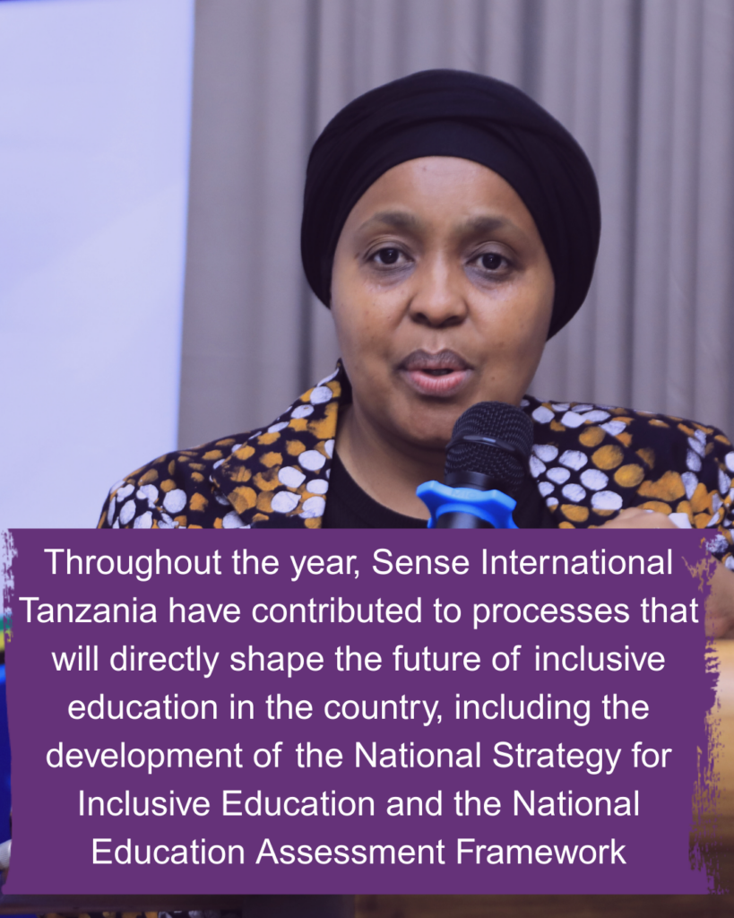 A Tanzanian woman wearing a headscarf speaks into a microphone. Text reads: Throughout the year, Sense International Tanzania have contributed to processes that will directly shape the future of inclusive education in the country, including the development of the National Strategy for Inclusive Education and the National Education Assessment Framework.